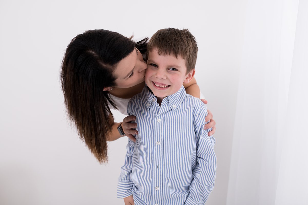 mom and son on white background